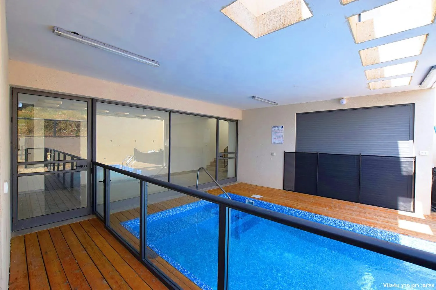 Kinneret House – the pool and glass doors to the living room